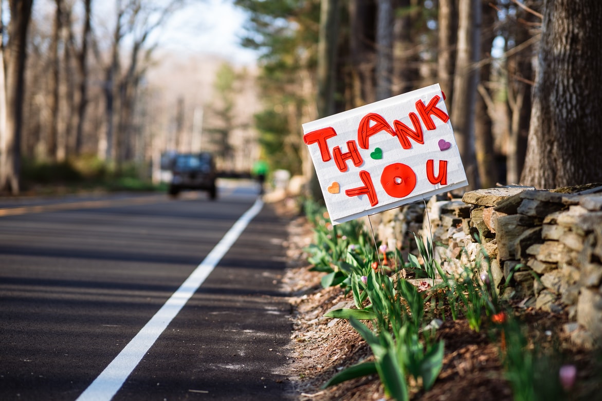 Sign in the road with thank you